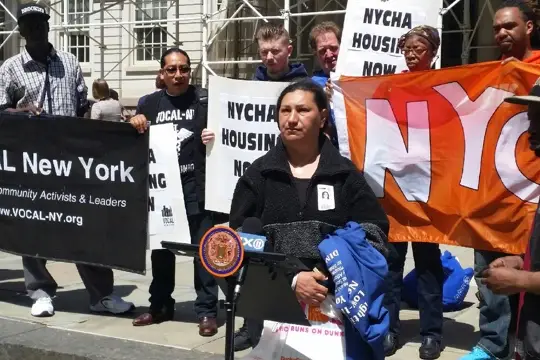 NYCHA resident Ann Valdez speaking at today's rally.
